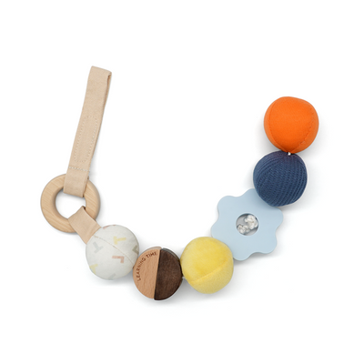 Colorful baby teething ring with various beads on a white background