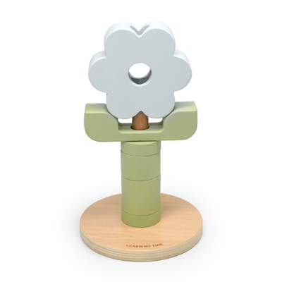 Wooden toy with a flower-shaped top on a white background