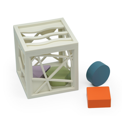White geometric cube with colorful blocks on a white background