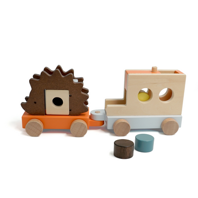 Wooden toy train with a hedgehog-shaped car on a white background